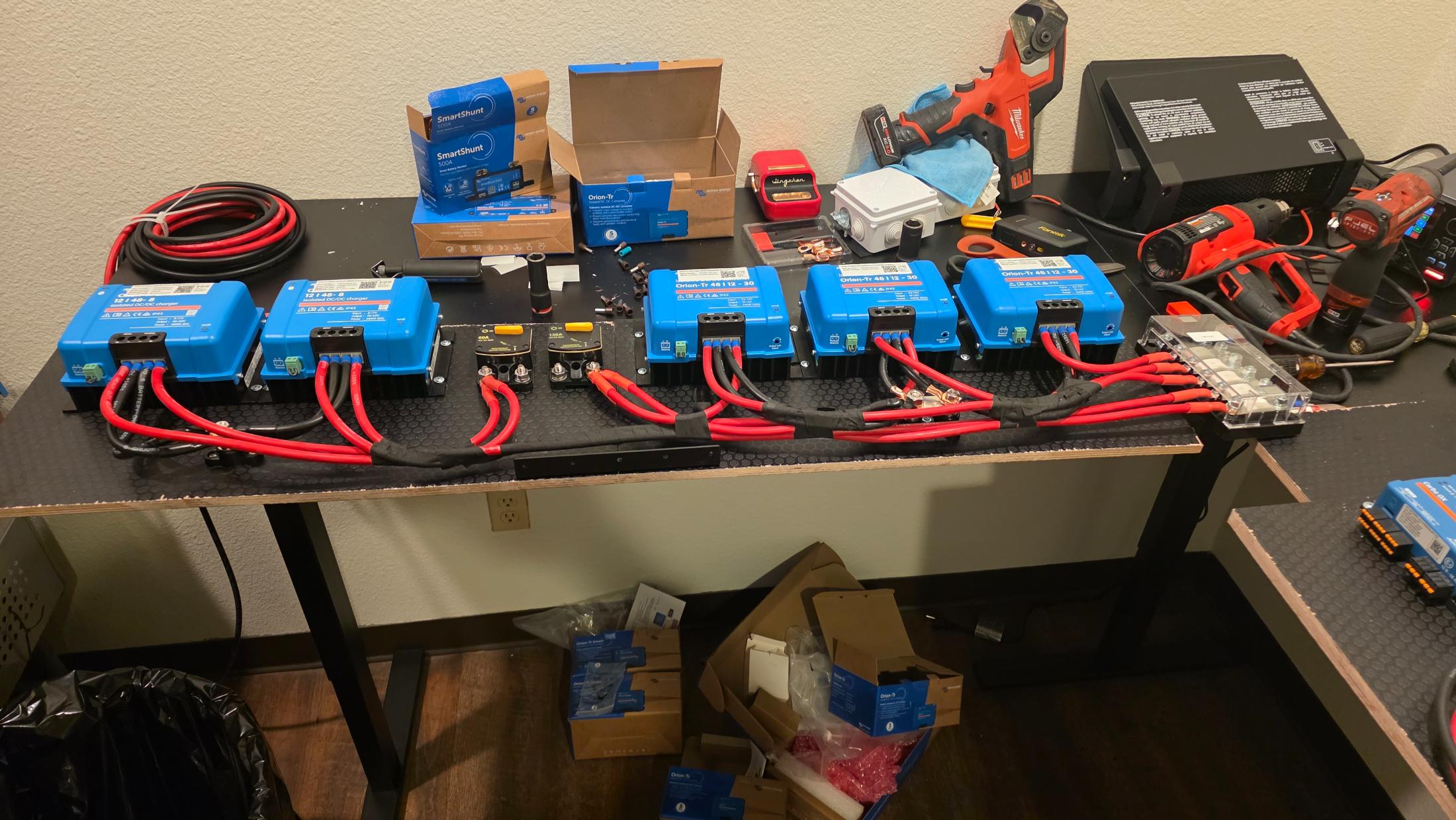 Victron components laid out for a Class B van electrical upgrade